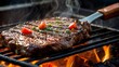 Grilling beef steak on barbecue grill with flames and hot coals