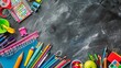 Vibrant school supplies arranged in a bottom border against chalkboard background - educational stationery and tools for creative learning
