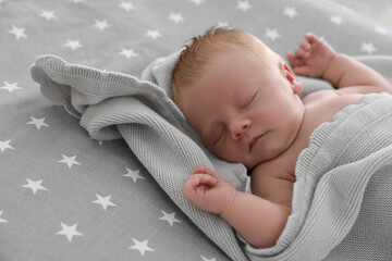 Poster - Cute little baby under soft plaid sleeping on bed