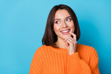 Canvas Print - Portrait of attractive cheerful bewildered curious girl touching lip guessing copy space isolated over vivid blue color background