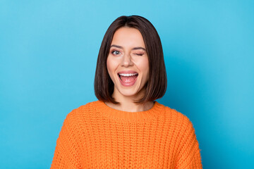 Wall Mural - portrait of attractive flirty cheerful girl winking good mood isolated over vibrant blue color backg