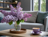 Fototapeta Kwiaty -  Living room interior in a spring arrangement in shades of gray and purple with a bouquet of lilacs in a vase