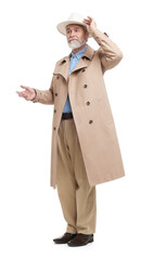 Wall Mural - Senior man in hat and coat on white background