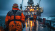 Oil platform workers, donning high-visibility waterproof gear, face the relentless onslaught of a sea storm while ensuring the continuous operation of the rig