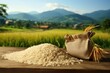 Bag of rice on wooden table, suitable for food and agriculture concepts