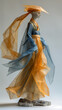 Origami papier mache woman in long colored dress walking