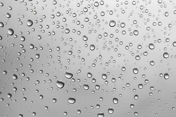 Poster - Clear image of water droplets on a window. Suitable for various projects