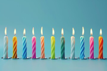 Poster - Row of brightly lit birthday candles against a blue background. Ideal for birthday celebrations