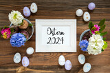 Fototapeta Mapy - Spring Flowers With Easter Egg Decoration, Ostern 2024 Means Easter 2024, Frame