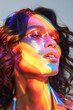 © Pajaros Volando - Portrait close up of woman wearing glitter and rainbow light reflected on face. Vertical image. Pride month concept