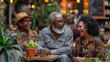 © SnapVault - Two elderly women and an elderly man engage in a pleasant conversation while having coffee in a botanical cafe, enjoying the daily life of people in retirement.