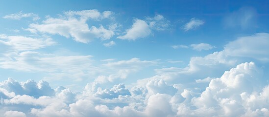 Wall Mural - an aircraft is flying in the sky with fluffy clouds in the background