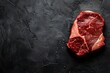Raw dry aged bison beef rump steak piece and slices offered as close-up on black background with copy space. ai generative