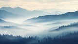 Fototapeta Na ścianę - An ethereal scene of foggy trees forms a blurred background.





