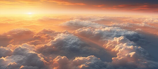 Wall Mural - the suns rays are peeking through the cumulus clouds in the atmospheric sky, casting a warm afterglo