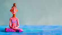 Meditating Woman, Wooden Artistic Sculpture. Banner With Copy Space.