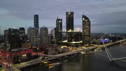 Wall Mural - Aerial drone descending view of Brisbane central business district, QLD, Australia along Brisbane River during the late afternoon in March 2024 