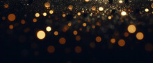 ゴールドの輝き粒子は、背景を抽象化します。ネイビー ブラックの背景にクリスマス黄金の光輝く粒子のボケ味。休日のコンセプト。抽象的な背景と金の粒子。