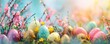 A colorful bunch of Easter eggs are scattered on a green and pink background