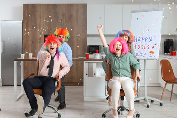 Poster - Business people celebrating April Fools' Day in kitchen at office party