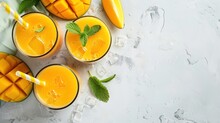 Refreshing And Healthy Mango Smoothie In Tall Glasses