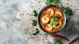 Fototapeta Panele - tom yum kung Spicy Thai soup with shrimp in a black bowl on a dark stone background