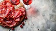 Wooden board with delicious jamon and red wine on light background