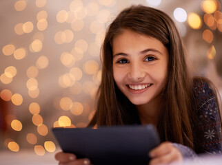 Portrait, night or girl with tablet for streaming, playing games or watching videos on a movie website. Smile, house or happy child with technology to download online or social media app to relax