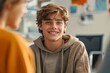© Akanksha - Smiling teenage boy talking with mental health professional while sitting on chair in school office, Generative AI
