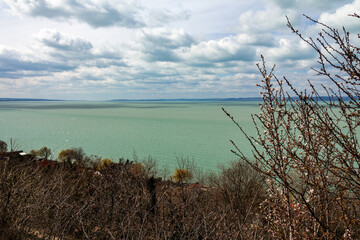 Wall Mural - Landscape with lake and blue sky with clouds.