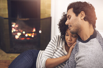 Sticker - Couple, fireplace and relax in hug, home and peace or calm and proud of marriage or commitment. People, love and embrace on floor in living room on weekend, support and trust in relationship