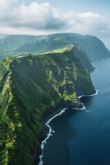 Poster - A stunning aerial view of the ocean and majestic mountains. Perfect for travel and nature concepts