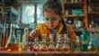 A young girl with glasses and a yellow jacket is engaged in an early chemistry experiment, focused intently on the colorful liquids in various flasks and beakers in front of her