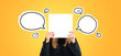 Young woman hiding face with blank empty banner, mock up speech bubbles