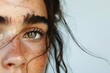 Beautiful model woman posing close up eyebrow on white studio background, close up shot