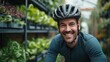 Joyful Urban Cyclist, beaming cyclist with helmet pauses in an urban greenhouse, reflecting a healthy, sustainable lifestyle amidst lush greenery