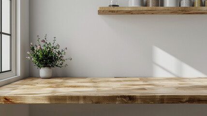 Poster - A wooden table with a potted plant on top of it. The plant is a small green bush with pink flowers. The table is empty and the room is very clean