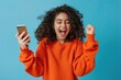 girl looking at smartphone Happy Indian teenage customer screaming celebrating winning good news using mobile