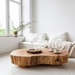 © ORG - Rustic edge coffee table made from a tree stump with a daybed near the window.