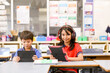 © Austockphoto - students in the classroom with headphones and iPads