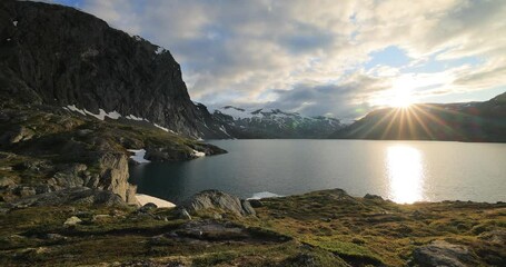 Wall Mural - Sunset against the backdrop of the Norwegian mountains. Beautiful Nature Norway natural landscape.