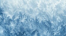 Background Texture Of Frosty Patterns On Glass. Delicate Ice Crystals Resembling Leaves And Ferns. Light Blue And White Colors.