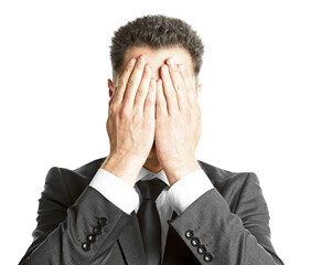 Canvas Print - A businessman covering his face with hands, expression of stress or disappointment, white background, concept of business pressure