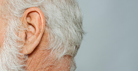 Wall Mural - elderly man ear detail close-up macro