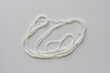 length of string coiled loosely around itself on paper