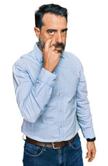 Sticker - Middle aged man with beard wearing business shirt pointing to the eye watching you gesture, suspicious expression