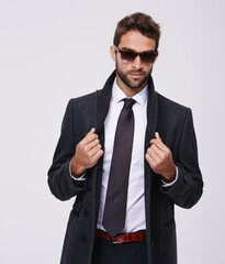Wall Mural - Studio, fashion and man with professional coat, sunglasses or eyewear for aesthetic, portrait and confidence. Adult, male person and guy with grey background, stylish and employee for business