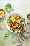 Fototapeta Tematy - Salmon and potato salad with asparagus, broccoli and radish, top view