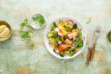 Canvas Print - Salmon and potato salad with asparagus, broccoli and radish, top view