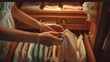 Woman organizing clothes in a drawer